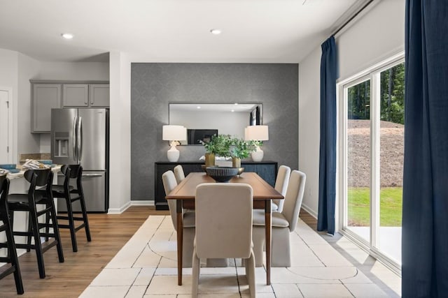 dining area with light hardwood / wood-style floors