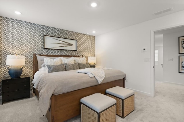 bedroom featuring light colored carpet