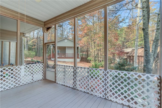 sunroom / solarium featuring a healthy amount of sunlight