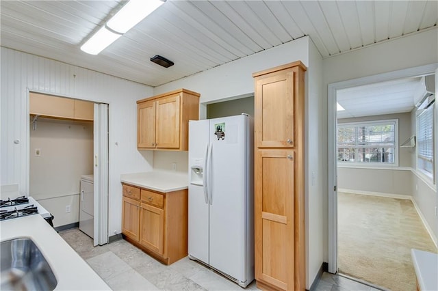 kitchen with wood ceiling, white appliances, light colored carpet, sink, and light brown cabinets