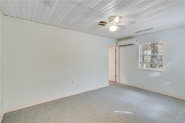 carpeted empty room with an AC wall unit and ceiling fan