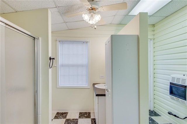 bathroom featuring walk in shower, heating unit, vaulted ceiling, a paneled ceiling, and vanity