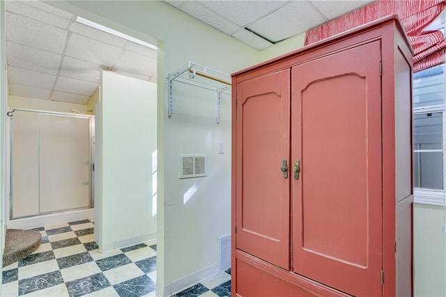 bathroom with a drop ceiling