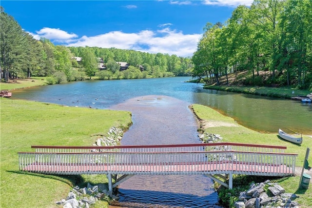 surrounding community featuring a water view