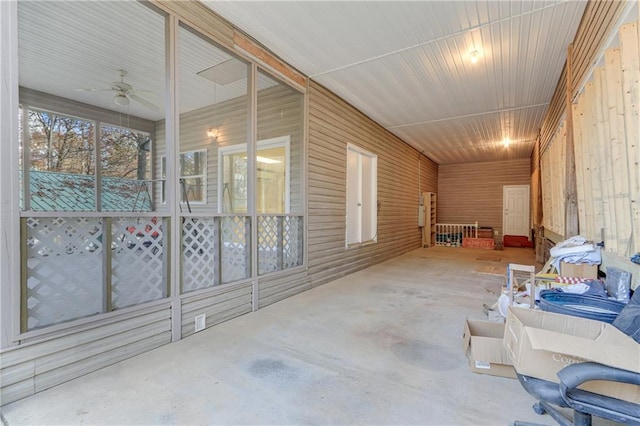 sunroom / solarium featuring ceiling fan