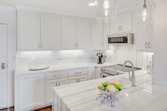300 Johnson Ferry Rd NE Unit A706, Atlanta, GA 30328 - kitchen with white cabinetry, electric stove, a sink, pendant lighting, and ornamental molding