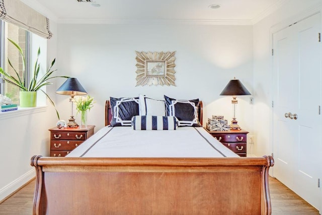 300 Johnson Ferry Rd NE Unit A706, Atlanta, GA 30328 - bedroom featuring light wood-type flooring, crown molding, and baseboards