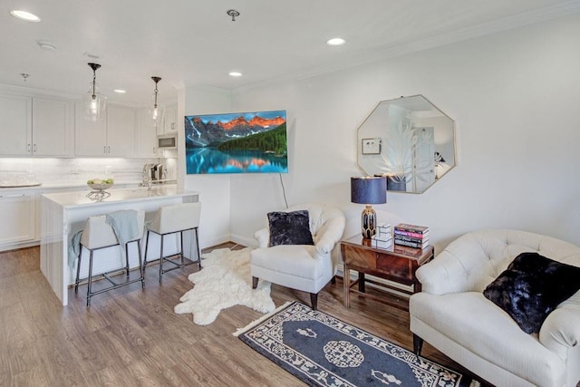 300 Johnson Ferry Rd NE Unit A706, Atlanta, GA 30328 - living area featuring crown molding, recessed lighting, wood finished floors, and baseboards