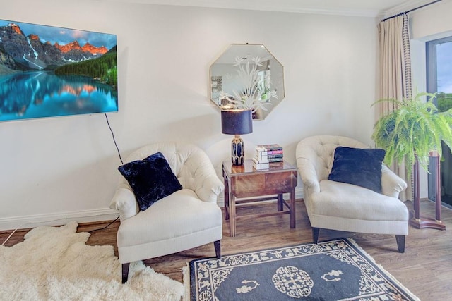 300 Johnson Ferry Rd NE Unit A706, Atlanta, GA 30328 - living area with wood finished floors, ornamental molding, and baseboards