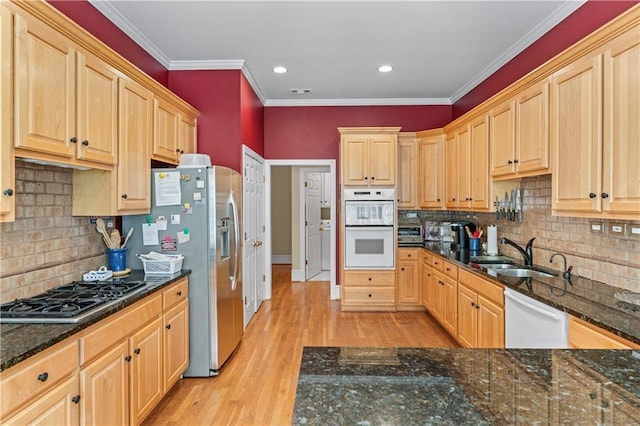 2117 Stephens Walk, Dunwoody, GA 30338 - kitchen featuring a sink, appliances with stainless steel finishes, light brown cabinets, tasteful backsplash, and ornamental molding