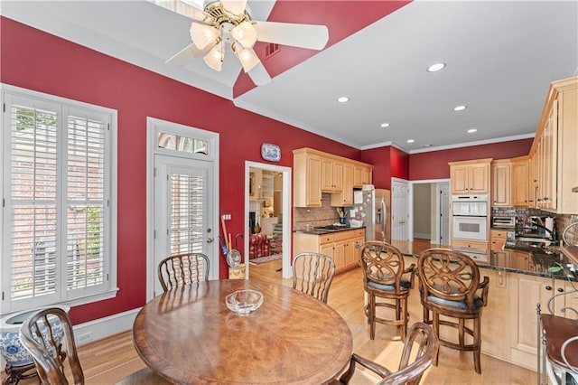 2117 Stephens Walk, Dunwoody, GA 30338 - dining area with a ceiling fan, plenty of natural light, light wood-style flooring, recessed lighting, and ornamental molding
