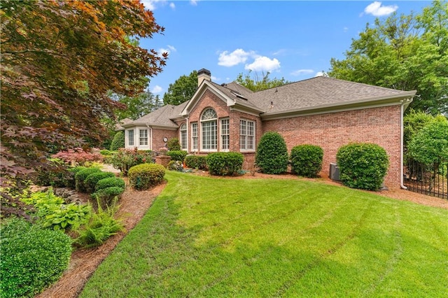 2117 Stephens Walk, Dunwoody, GA 30338 - view of front of house with a chimney, brick siding, and roof with shingles