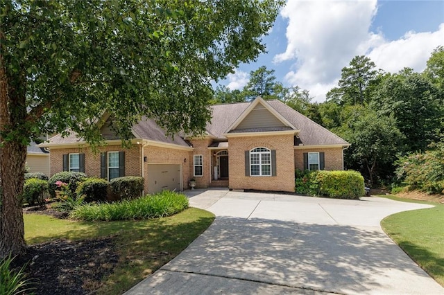 view of front of house with concrete driveway, brick siding, and an attached garage