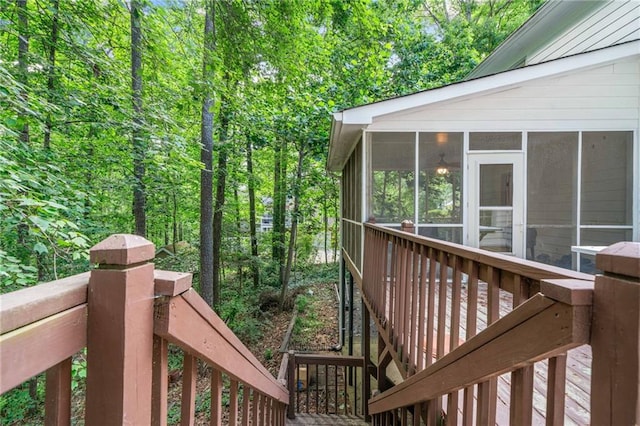 wooden deck with a sunroom