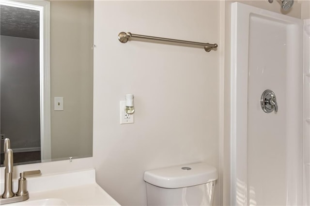 bathroom featuring toilet and sink