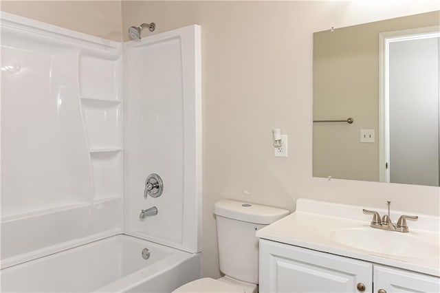 full bathroom featuring vanity, bathtub / shower combination, and toilet