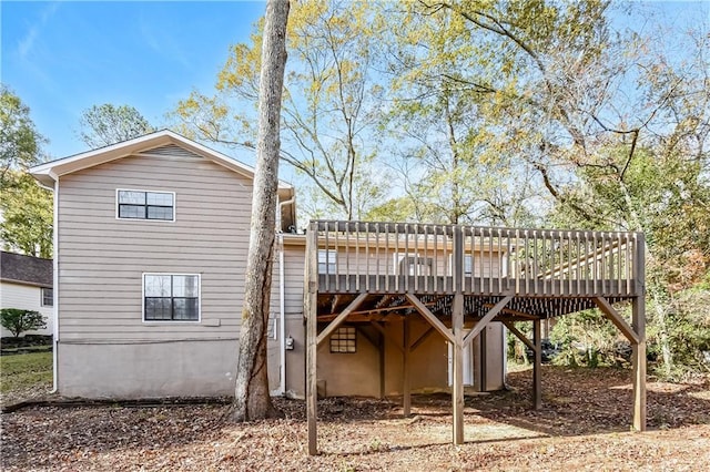 view of side of property featuring a deck