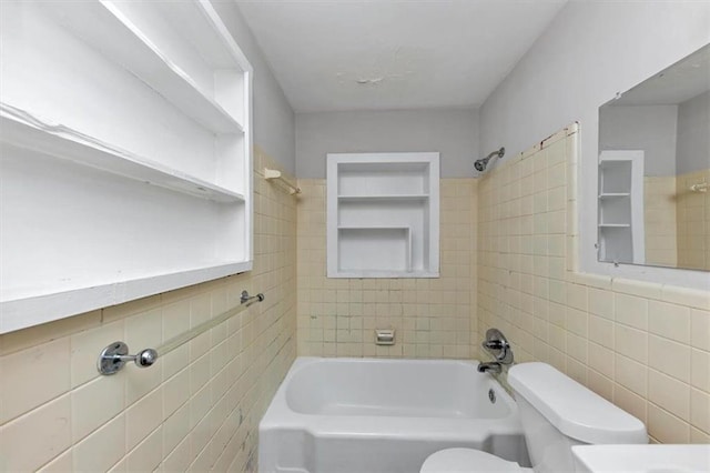 full bathroom with toilet, tile walls, and shower / bathtub combination