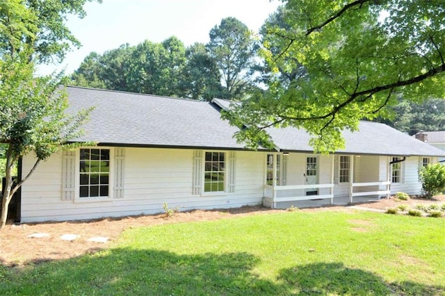 5974 SW Four Winds Dr SW, Lilburn, GA 30047 - ranch-style house with roof with shingles, a front lawn, and a porch