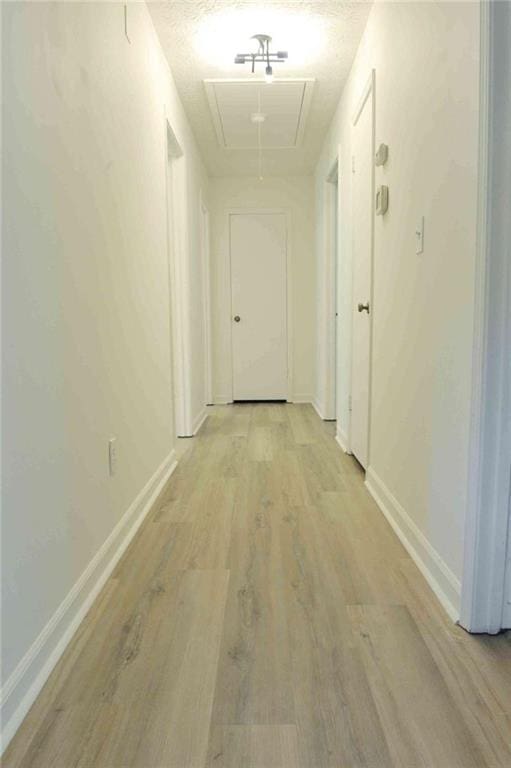 5974 SW Four Winds Dr SW, Lilburn, GA 30047 - hallway with attic access and light wood-type flooring