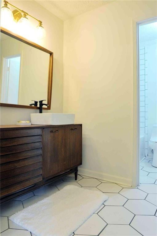 5974 SW Four Winds Dr SW, Lilburn, GA 30047 - bathroom with vanity and tile patterned floors