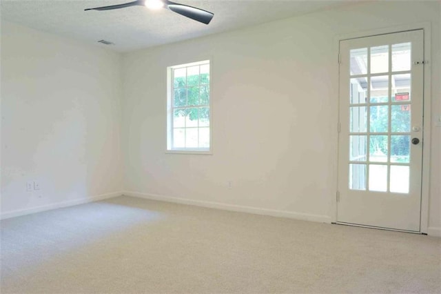 5974 SW Four Winds Dr SW, Lilburn, GA 30047 - spare room with light carpet and a ceiling fan