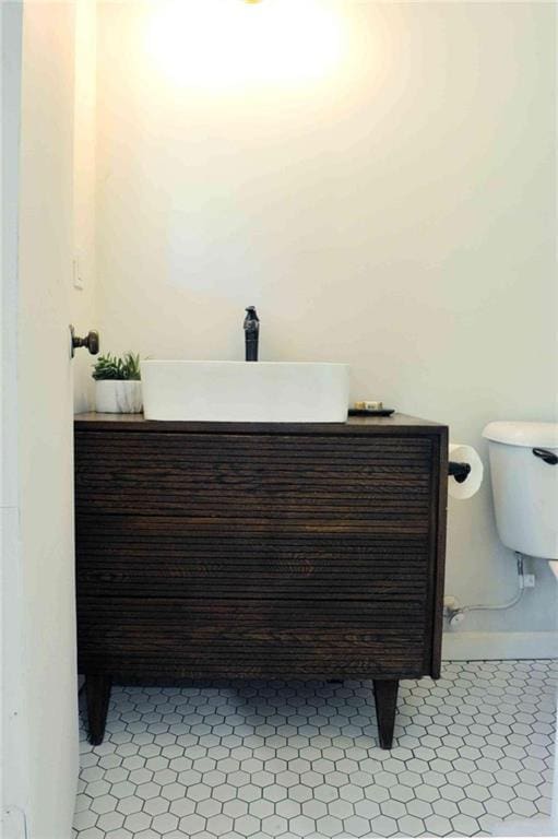 5974 SW Four Winds Dr SW, Lilburn, GA 30047 - bathroom with vanity and toilet