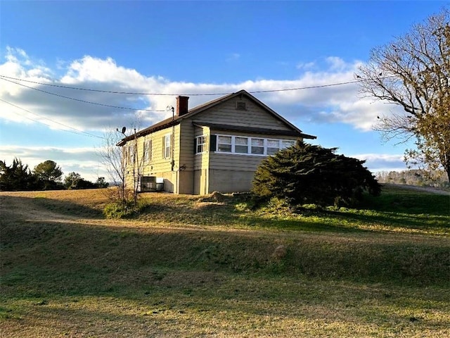 view of home's exterior featuring a yard