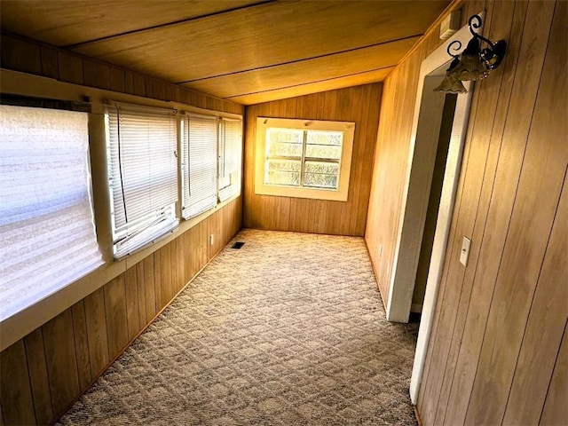 sunroom featuring lofted ceiling and wood ceiling