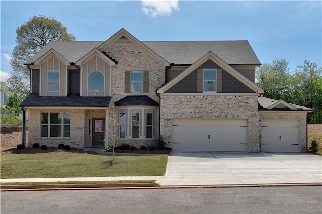 view of front of house with a garage and a front lawn