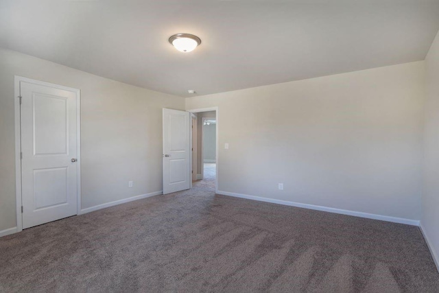 empty room featuring carpet flooring