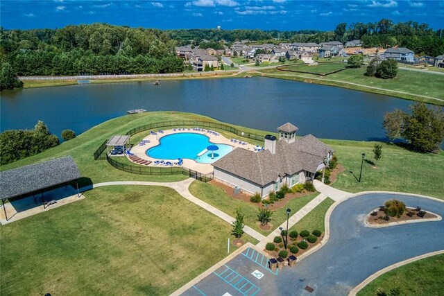 view of pool with a yard