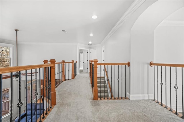 hall with visible vents, crown molding, carpet floors, an upstairs landing, and recessed lighting