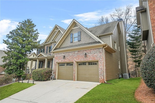 craftsman inspired home with brick siding, concrete driveway, and a front yard