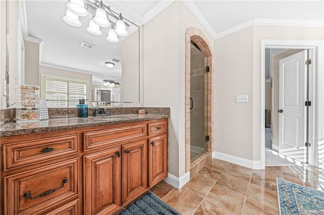 bathroom featuring visible vents, baseboards, ornamental molding, a stall shower, and vanity