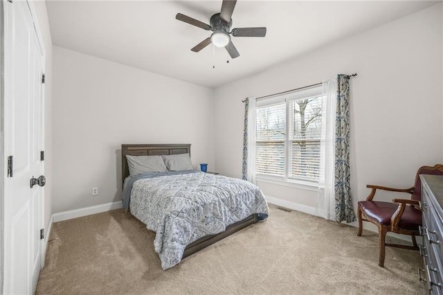 bedroom featuring visible vents, baseboards, and carpet