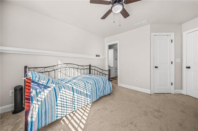 carpeted bedroom with visible vents, baseboards, and ceiling fan