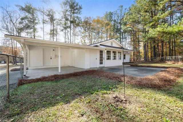 exterior space featuring a front yard and a patio