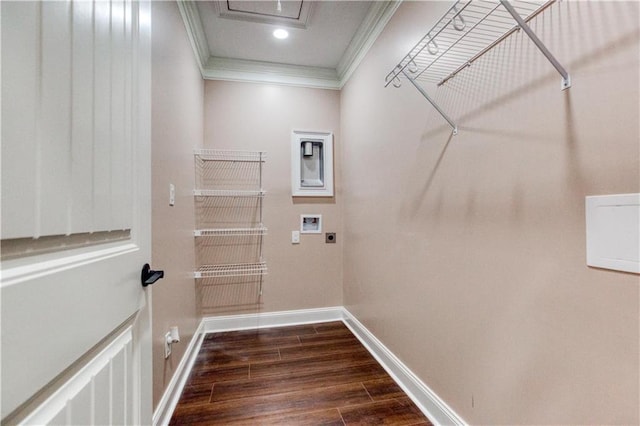 washroom with washer hookup, dark wood finished floors, crown molding, laundry area, and baseboards