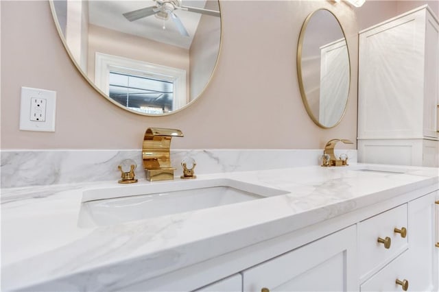 bathroom featuring double vanity and a sink