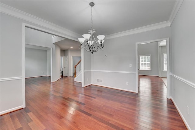 3805 Roxwood Park Dr, Buford, GA 30518 - unfurnished room featuring ornamental molding, wood finished floors, a chandelier, stairs, and baseboards
