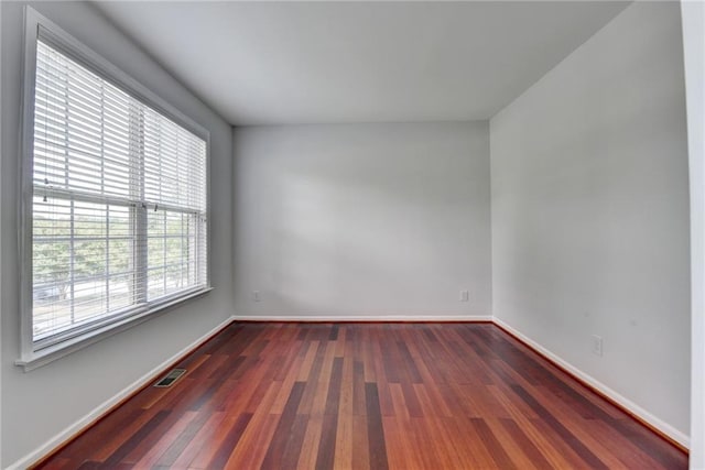 3805 Roxwood Park Dr, Buford, GA 30518 - unfurnished room featuring wood finished floors and baseboards