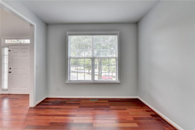3805 Roxwood Park Dr, Buford, GA 30518 - spare room with healthy amount of natural light and wood finished floors