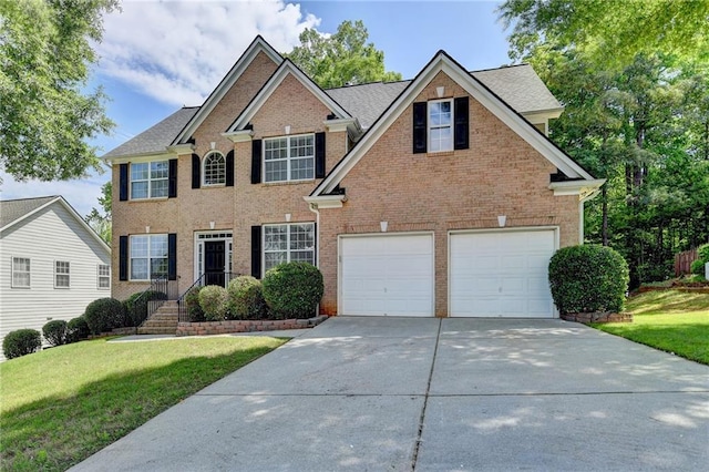 3805 Roxwood Park Dr, Buford, GA 30518 - colonial home featuring concrete driveway, a front lawn, brick siding, and an attached garage