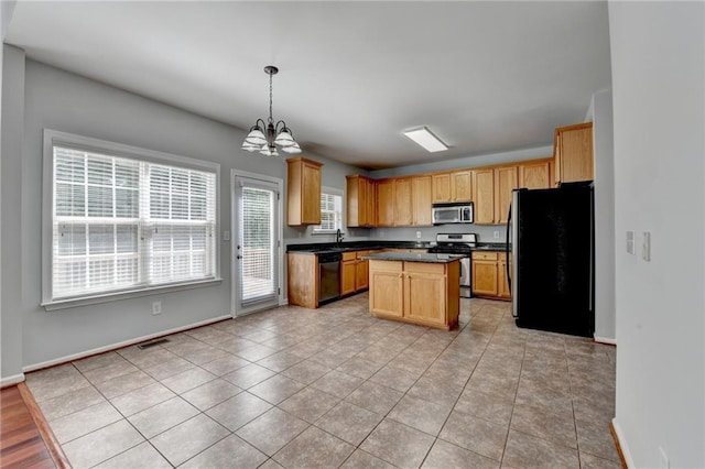 3805 Roxwood Park Dr, Buford, GA 30518 - kitchen with appliances with stainless steel finishes, a chandelier, dark countertops, a center island, and light tile patterned flooring