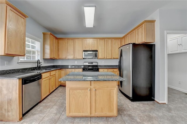 3805 Roxwood Park Dr, Buford, GA 30518 - kitchen with stainless steel appliances, light brown cabinetry, and dark stone countertops