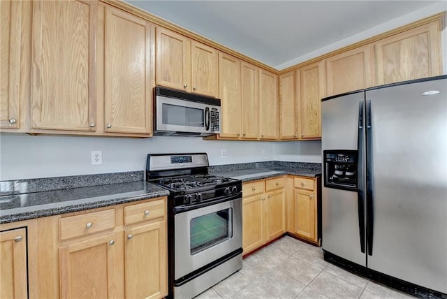 3805 Roxwood Park Dr, Buford, GA 30518 - kitchen with stainless steel appliances, light brown cabinets, light tile patterned flooring, and dark stone counters