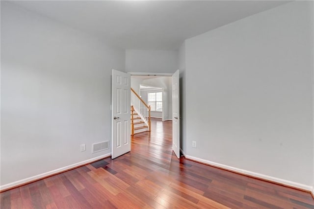 3805 Roxwood Park Dr, Buford, GA 30518 - empty room featuring baseboards, wood finished floors, and stairs