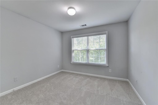 3805 Roxwood Park Dr, Buford, GA 30518 - spare room featuring light colored carpet and baseboards