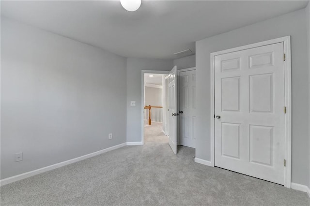 3805 Roxwood Park Dr, Buford, GA 30518 - unfurnished bedroom featuring carpet flooring, baseboards, and a closet